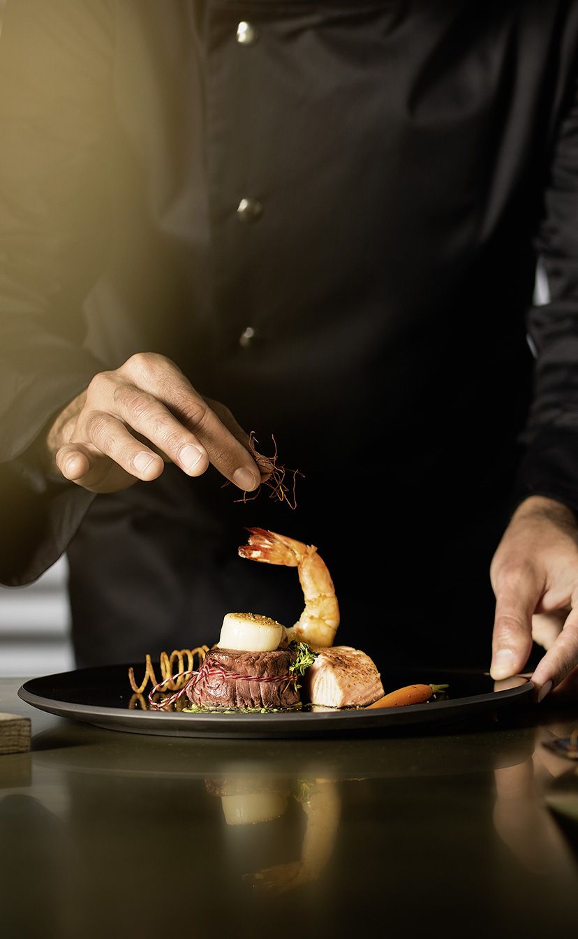 Chef plating gourmet dish